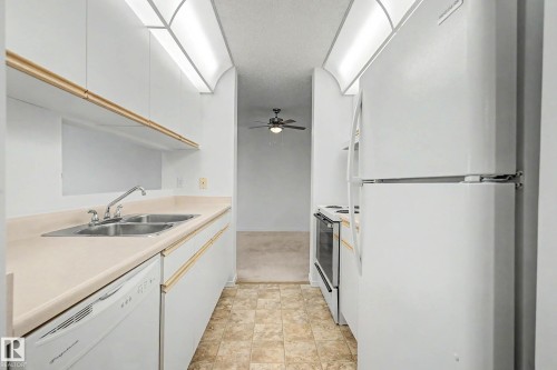 #452 10520 120 Nw, Edmonton, AB - Indoor Photo Showing Kitchen With Double Sink