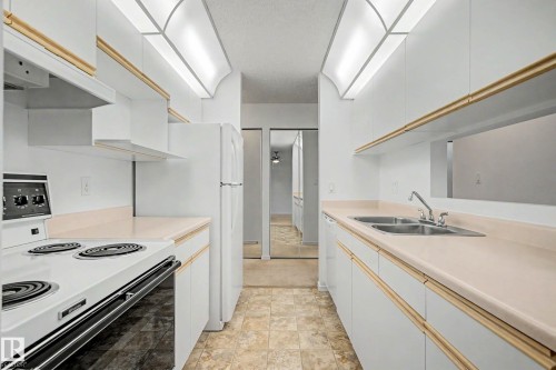 #452 10520 120 Nw, Edmonton, AB - Indoor Photo Showing Kitchen With Double Sink