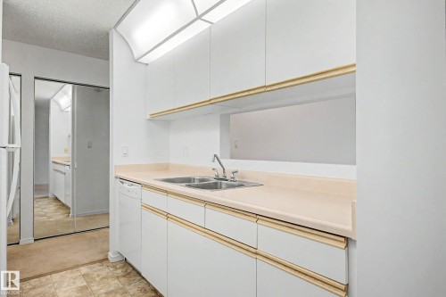 #452 10520 120 Nw, Edmonton, AB - Indoor Photo Showing Kitchen With Double Sink