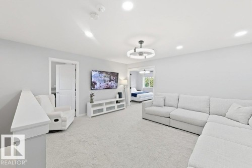 Carpeted bonus room with recessed lighting and a contemporary ceiling fan - 4242 Chichak Close Sw, Edmonton, AB - Indoor Photo Showing Other Room