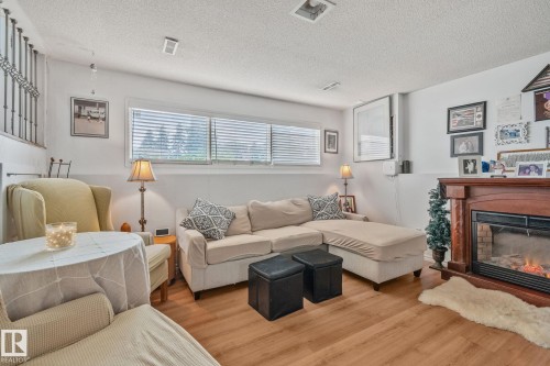 4682 17 Avenue Nw, Edmonton, AB - Indoor Photo Showing Living Room With Fireplace