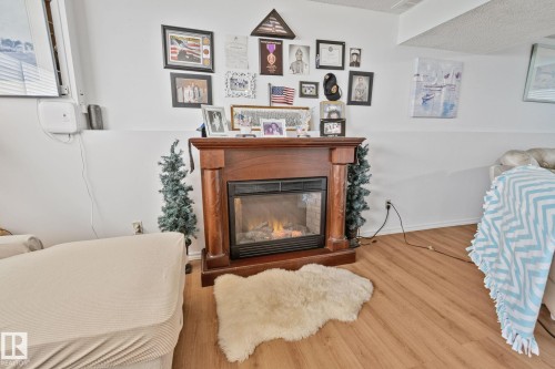 4682 17 Avenue Nw, Edmonton, AB - Indoor Photo Showing Living Room With Fireplace