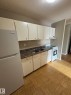 #315 7220 144 Av Nw, Edmonton, AB  - Indoor Photo Showing Kitchen With Double Sink 