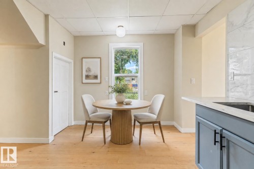 Wood-finish flooring throughout - 12337 128 Avenue Nw, Edmonton, AB - Indoor Photo Showing Dining Room