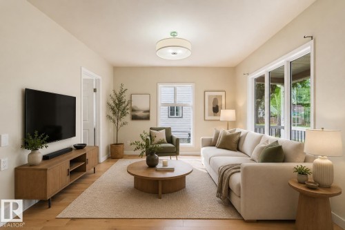 Spacious living area featuring light-toned walls, wood-finish flooring, and large windows - 12337 128 Avenue Nw, Edmonton, AB - Indoor Photo Showing Living Room