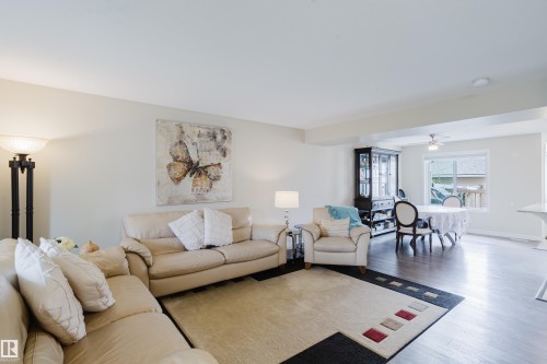 Spacious living area featuring light-toned walls, recessed lighting, and wood-finish flooring - 124 Cy Becker Boulevard Nw, Edmonton, AB - Indoor Photo Showing Living Room