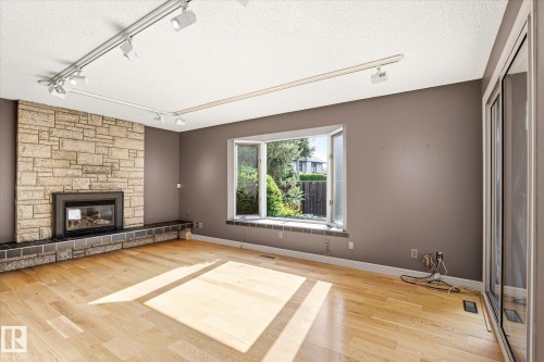 241 Greenoch Crescent Nw, Edmonton, AB - Indoor Photo Showing Living Room With Fireplace