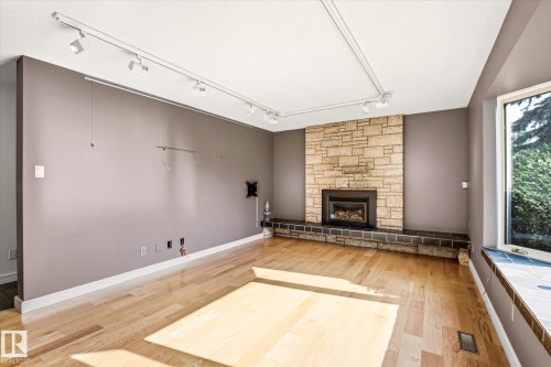 241 Greenoch Crescent Nw, Edmonton, AB - Indoor Photo Showing Living Room With Fireplace