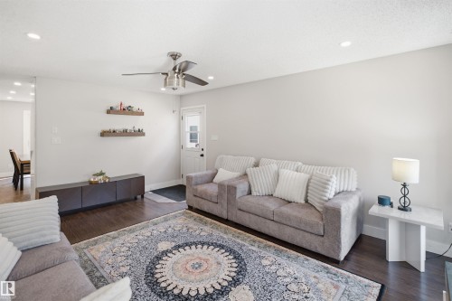 Recessed lighting, wood-finish flooring, and a ceiling fan with integrated lighting - 3515 20 Ave Nw, Edmonton, AB - Indoor Photo Showing Living Room