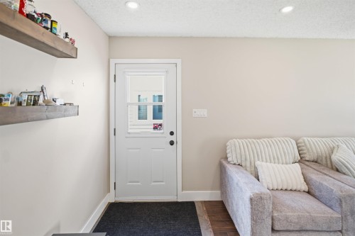 Recessed lighting, wood-finish flooring, and white trim - 3515 20 Ave Nw, Edmonton, AB - Indoor Photo Showing Other Room