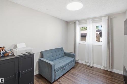 Wood-finish flooring, white walls, and a contemporary flush-mount ceiling light - 3515 20 Ave Nw, Edmonton, AB - Indoor