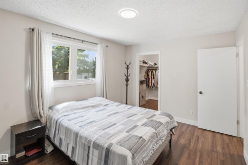 Wood-finish flooring, white walls, and a window with white trim - 3515 20 Ave Nw, Edmonton, AB - Indoor Photo Showing Bedroom