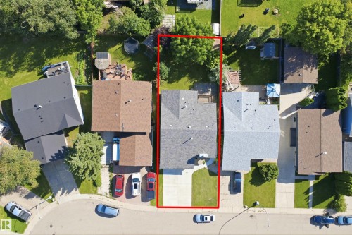 Single-family residence with a light gray shingle roof, a front-facing driveway, and a fenced backyard - 3515 20 Ave Nw, Edmonton, AB - Outdoor With View