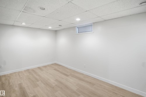 Recessed lighting, wood-finish flooring, and a drop ceiling - 3515 20 Ave Nw, Edmonton, AB - Indoor Photo Showing Other Room