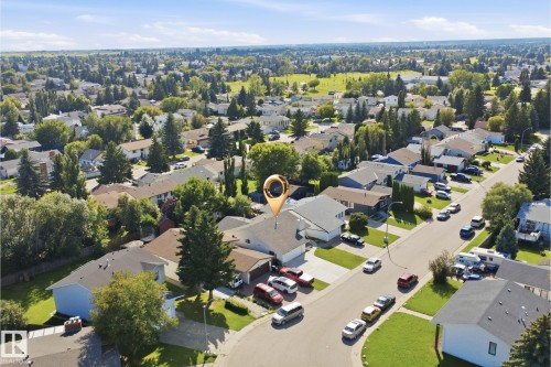 Residential neighborhood with mature trees and a clear sky - 3515 20 Ave Nw, Edmonton, AB - Outdoor With View