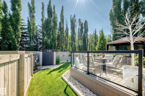 Spacious outdoor deck with glass panel railing and composite decking - 823 77 Street Sw, Edmonton, AB - Outdoor
