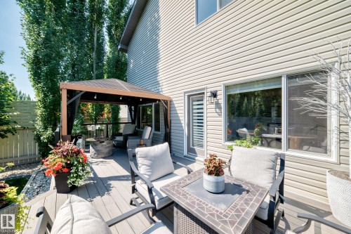 Multi-level deck featuring composite decking, an integrated gazebo with lighting, and a built-in fire pit - 823 77 Street Sw, Edmonton, AB - Outdoor With Deck Patio Veranda