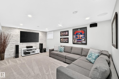 Accent wall featuring stacked stone veneer - 823 77 Street Sw, Edmonton, AB - Indoor With Fireplace