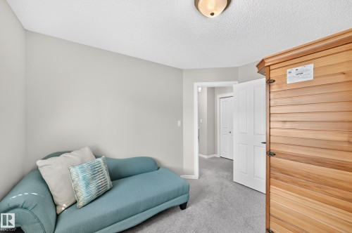 Room featuring light gray walls, gray carpet, and a flush-mount ceiling light - 823 77 Street Sw, Edmonton, AB - Indoor Photo Showing Other Room