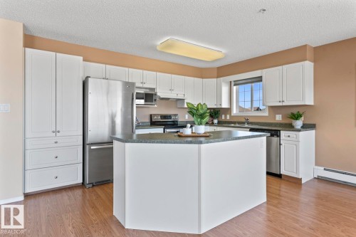 #201 1705 7 Av, Cold Lake, AB - Indoor Photo Showing Kitchen With Stainless Steel Kitchen