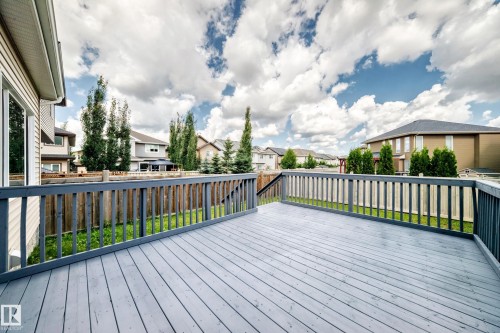 Spacious outdoor deck with a gray wood-finish surface and matching railings - 4212 Charles Close Sw, Edmonton, AB - Outdoor
