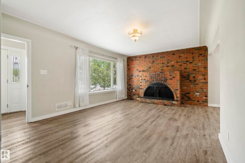 10426 79 Street Nw, Edmonton, AB - Indoor Photo Showing Living Room With Fireplace