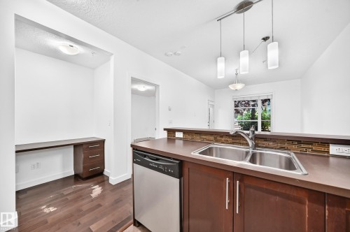 #102 2584 Anderson Way Sw, Edmonton, AB - Indoor Photo Showing Kitchen With Double Sink