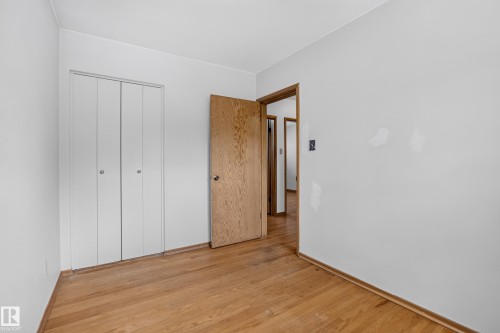 Hardwood flooring throughout - 16009 93A Avenue Nw, Edmonton, AB - Indoor Photo Showing Other Room