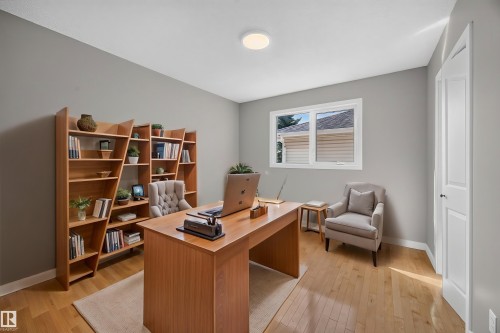 Light wood-finish flooring with light gray walls - 3640 31 Street Nw, Edmonton, AB - Indoor Photo Showing Office