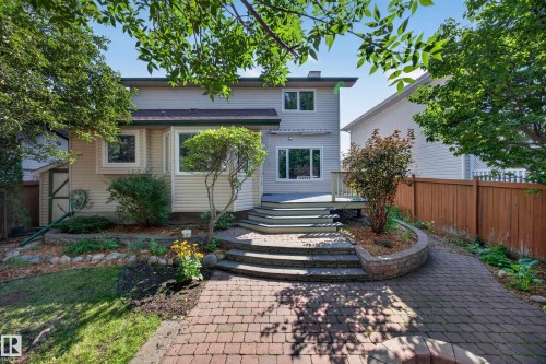 Exterior featuring a multi-level deck, bay window, and a paver stone pathway - 3640 31 Street Nw, Edmonton, AB - Outdoor