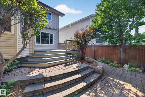 Multi-level paver patio featuring stone steps and landscaping - 3640 31 Street Nw, Edmonton, AB - Outdoor With Deck Patio Veranda