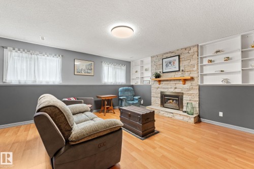 4224 33A Street Nw, Edmonton, AB - Indoor Photo Showing Living Room With Fireplace