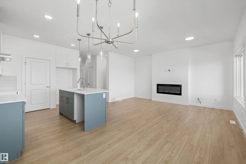 8616 183 Avenue Nw, Edmonton, AB - Indoor Photo Showing Kitchen With Fireplace