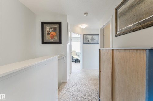 Carpeted hallway with painted walls and ceiling-mounted light fixtures - 8265 Chappelle Way Sw, Edmonton, AB - Indoor Photo Showing Other Room