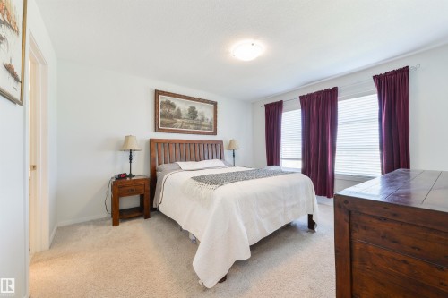 Wall-to-wall carpeting and white walls - 8265 Chappelle Way Sw, Edmonton, AB - Indoor Photo Showing Bedroom