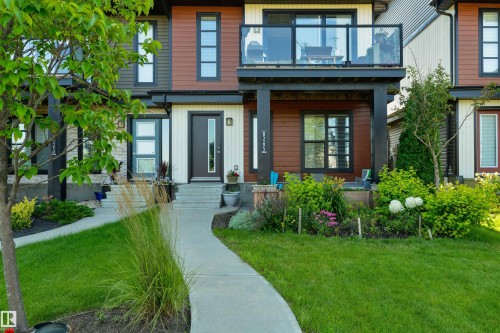 Contemporary exterior with multi-toned siding and stone accents - 8265 Chappelle Way Sw, Edmonton, AB - Outdoor With Facade