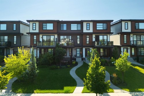 Modern multi-level exterior with varied siding, private balconies, and integrated pathways - 8265 Chappelle Way Sw, Edmonton, AB - Outdoor With Facade