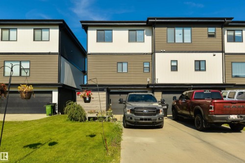 Modern multi-level exterior with horizontal siding and black-framed windows - 8265 Chappelle Way Sw, Edmonton, AB - Outdoor