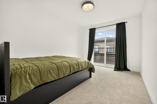 White walls complement the light-toned carpet - #53 16231 19 Av Sw, Edmonton, AB - Indoor Photo Showing Bedroom