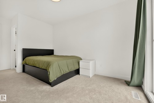Wall-to-wall carpeting with a light finish - #53 16231 19 Av Sw, Edmonton, AB - Indoor Photo Showing Bedroom