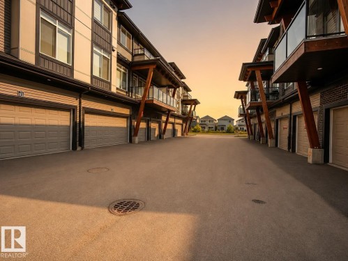 Integrated garage doors - #53 16231 19 Av Sw, Edmonton, AB - Outdoor With Balcony With Exterior