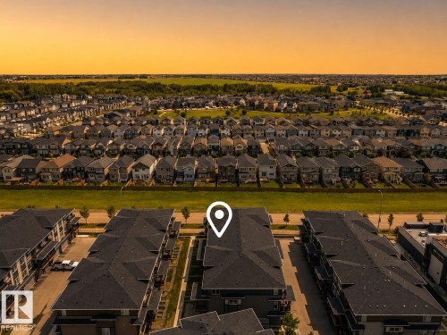 Expansive neighborhood featuring detached single-family residences and multi-unit buildings - #53 16231 19 Av Sw, Edmonton, AB - Outdoor With View