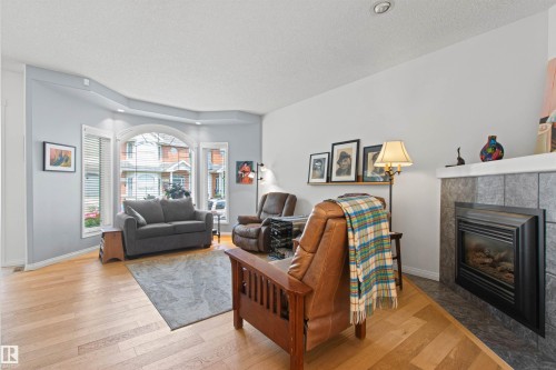 9135 100B Avenue Nw, Edmonton, AB - Indoor Photo Showing Living Room With Fireplace