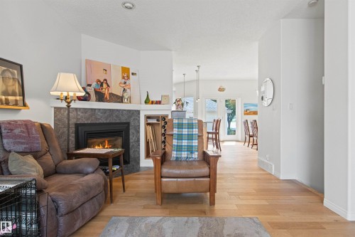 9135 100B Avenue Nw, Edmonton, AB - Indoor Photo Showing Living Room With Fireplace