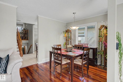 Hardwood flooring throughout, with a semi-flush mount ceiling light fixture - 193 Kiniski Crescent Nw, Edmonton, AB - Indoor Photo Showing Dining Room