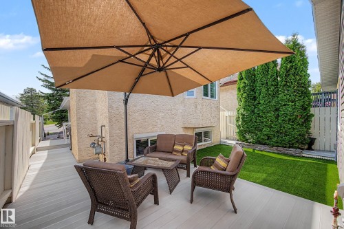 Expansive outdoor deck with composite decking, partial privacy fencing, and artificial turf area - 193 Kiniski Crescent Nw, Edmonton, AB - Outdoor With Deck Patio Veranda With Exterior
