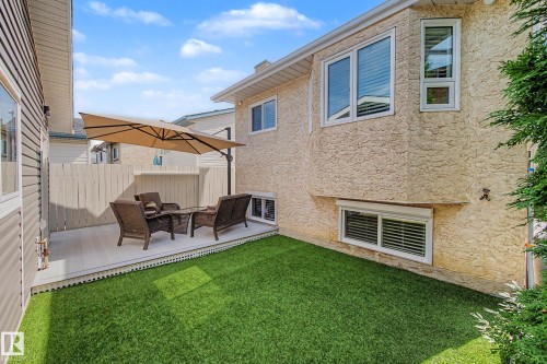 Raised composite deck with white lattice skirting and privacy fencing - 193 Kiniski Crescent Nw, Edmonton, AB - Outdoor With Deck Patio Veranda With Exterior