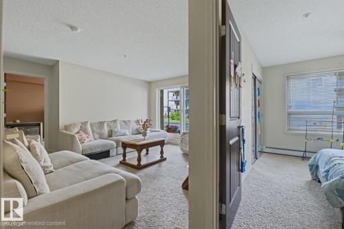 Soft, neutral wall color in the living area - #106 13907 136 St Nw, Edmonton, AB - Indoor Photo Showing Living Room