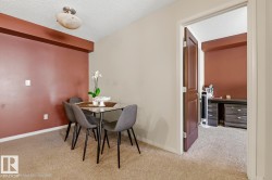 Neutral wall paint and an accent wall create a distinct dining area - 