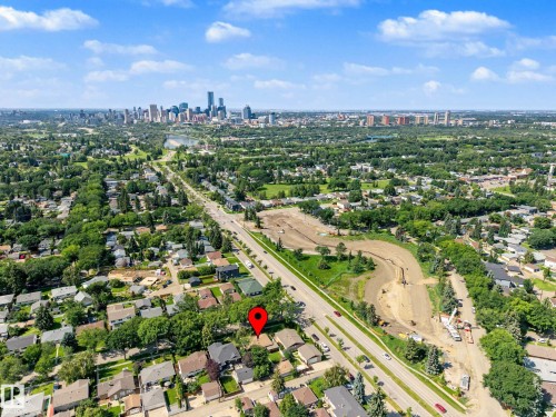 Aerial perspective showcasing a broad urban landscape with extensive greenery and a distant skyline - 9723 76 Street Nw, Edmonton, AB - Outdoor With View